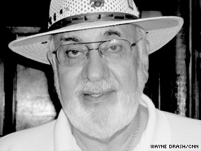 Portrait of Pat Davis in a hat and glasses
